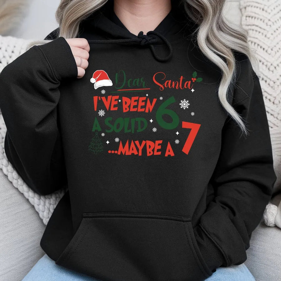 Dear Santa I've Been A Solid 7 Hoodie | Funny Christmas Meme Graphic Sweatshirt | Premium Cotton Blend | Humorous Holiday Gift For Him And Her