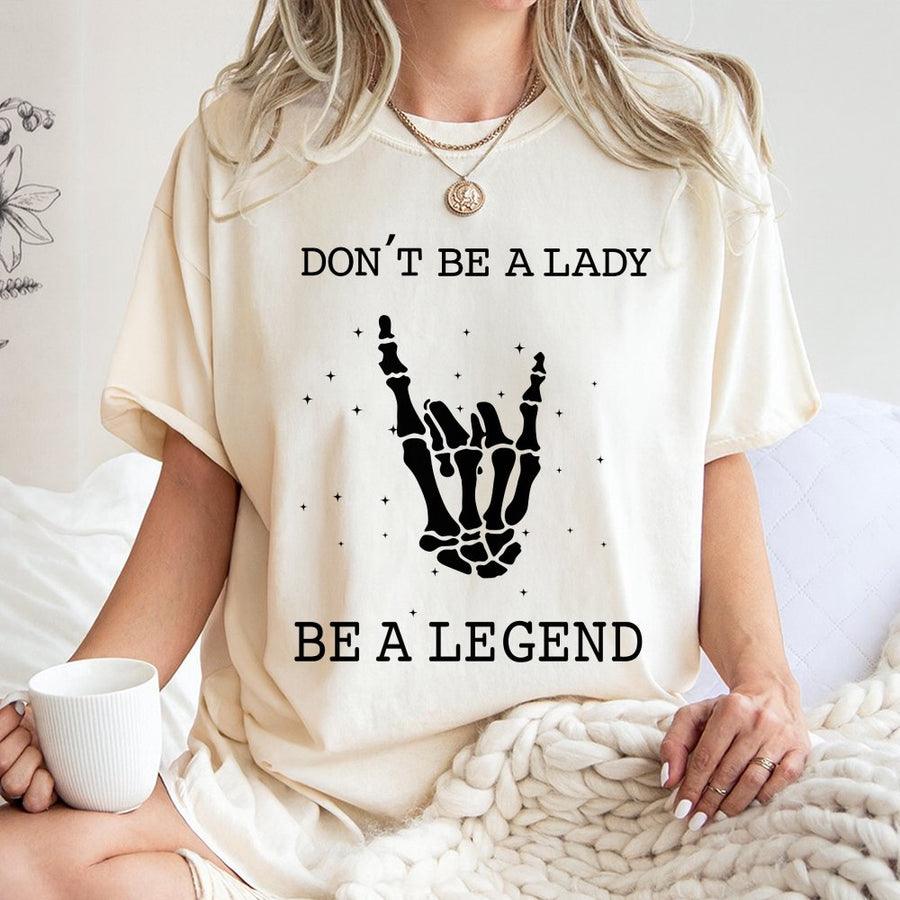 Don't Be A Lady Be A Legend T-Shirt | Skeleton Hand Rock Sign Graphic | 100% Cotton Premium Tee | Feminist Empowerment Gift For Her