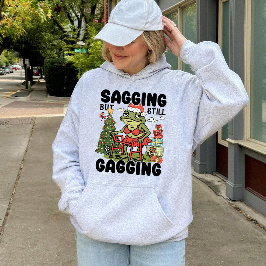 Funny Christmas Hoodie | Sagging But Still Gagging Frog Meme | Premium Cotton Blend Sweatshirt | Rude Adult Humor Holiday Gift for Friends