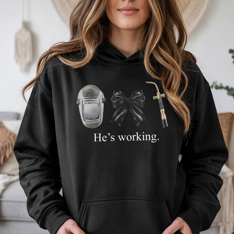 Welder Wife Hoodie | He's Working Welding Helmet Graphic | Premium Cotton Blend Sweatshirt | Funny Blue Collar Relationship Gift for Her