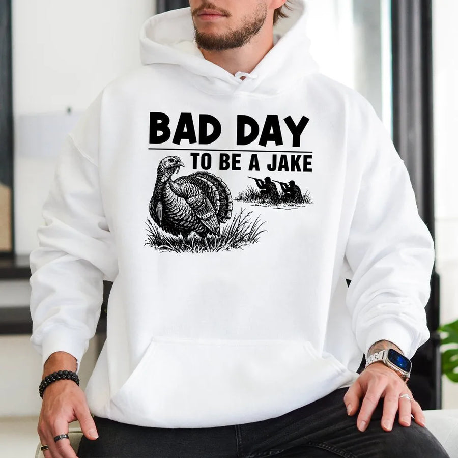 Bad Day To Be A Jake Hoodie | Funny Turkey Hunter Graphic Quote | Premium Cotton-Blend Sweatshirt | Unisex Gift for Hunter