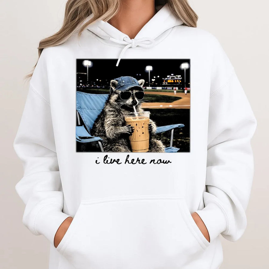 Funny Raccoon Baseball Hoodie | 'I Live Here Now' Graphic Tee | Soft Cotton Unisex Tee | Gift for Baseball Mom or Softball Dad Tournament Fan