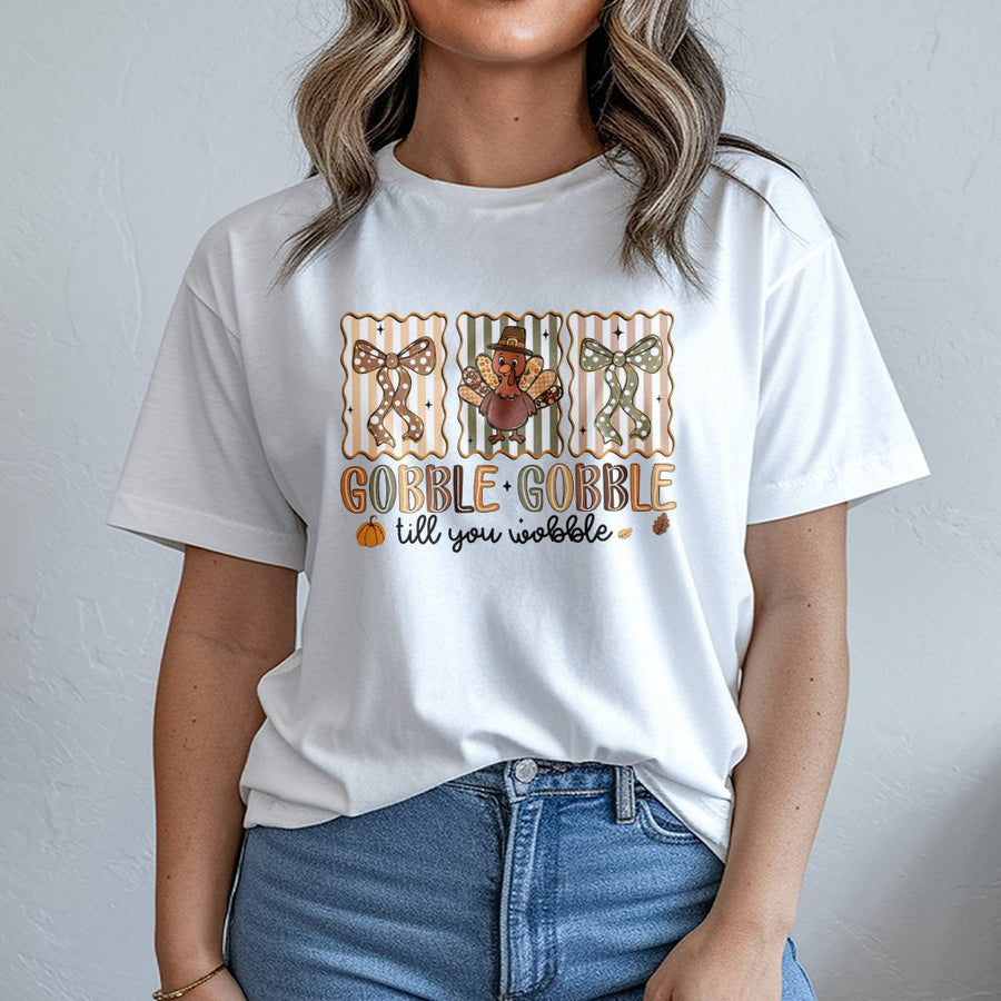 Gobble Gobble Till You Wobble T-Shirt | Funny Thanksgiving Turkey Graphic Tee | Soft Cotton Unisex Holiday Apparel | Cute Autumn Feast Gift