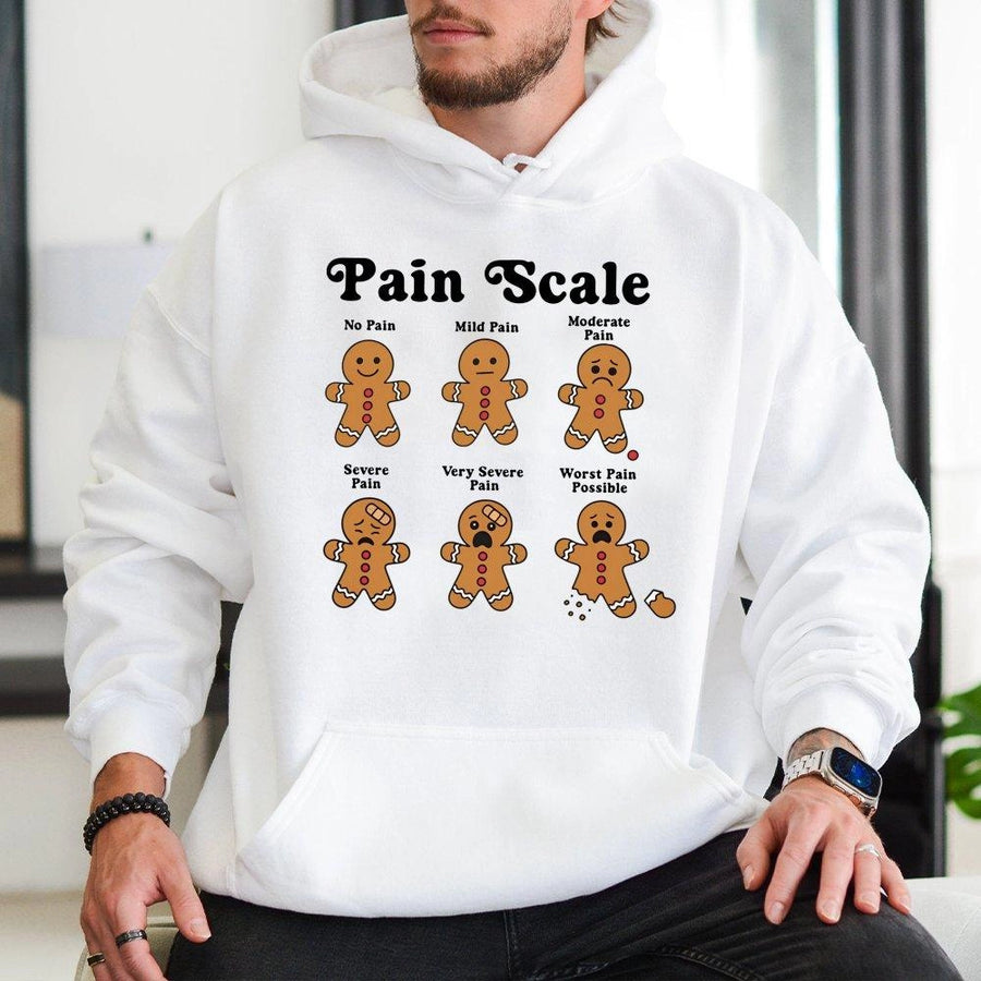 Funny Gingerbread Pain Scale Hoodie | Cute Nurse Christmas Graphic Sweatshirt | Premium Cotton-Poly Blend | Holiday Gift For Nurses & Medical Staff