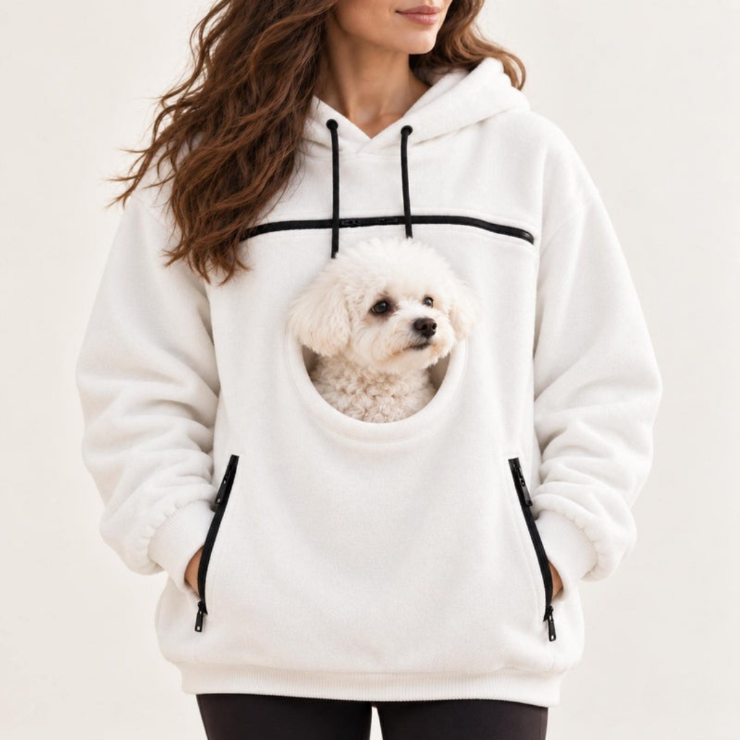 White pet carrier hoodie, dog looking out of the pouch opening