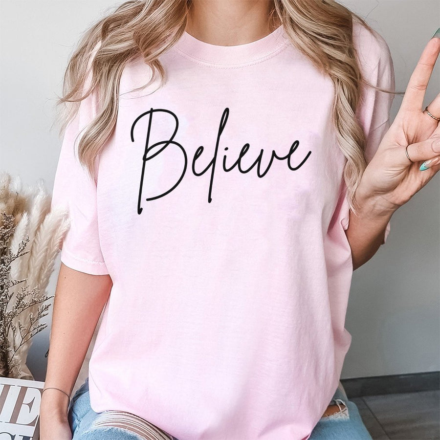 Believe Christmas T-Shirt | Minimalist Script Holiday Graphic | Premium 100% Cotton Tee | Festive Gift for Family and Friends