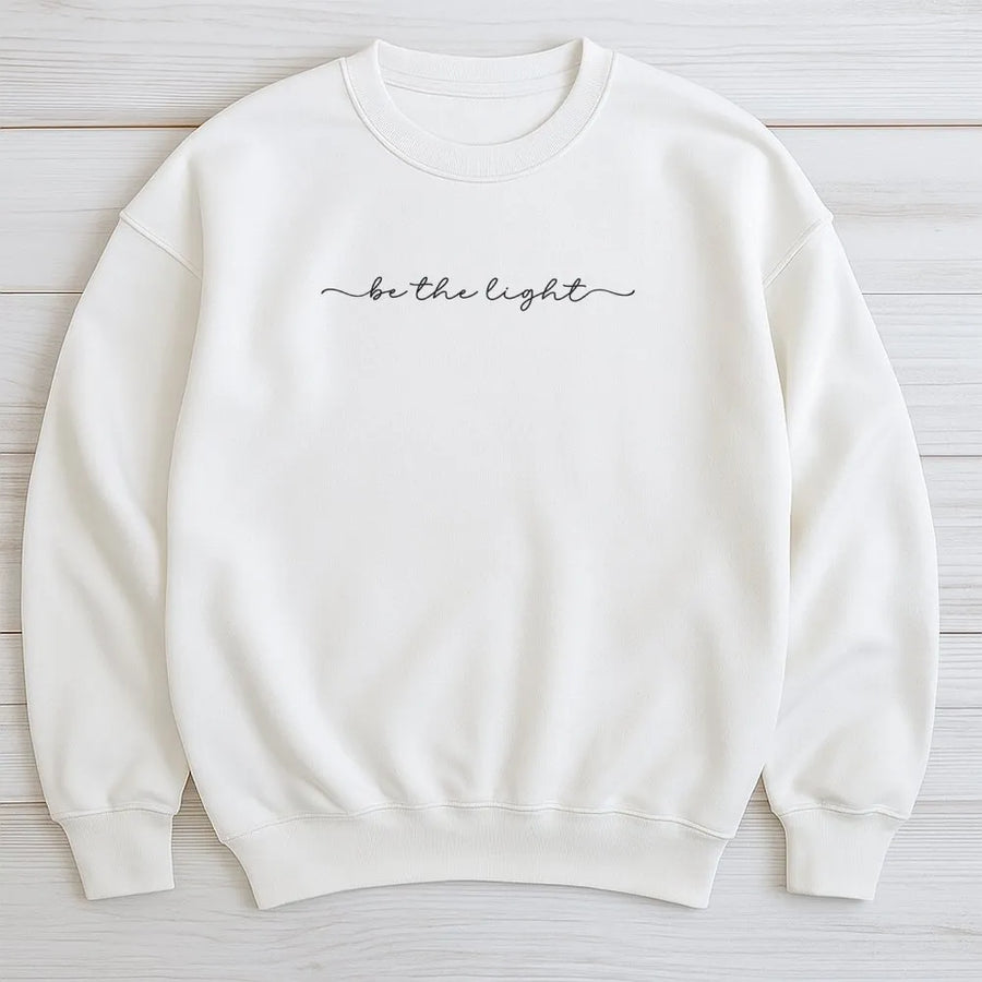 Be The Light Sweatshirt | Minimalist Christian Graphic Crewneck | Premium Cotton-Blend Comfort | Religious Faith Gift for Women & Bible Study Group