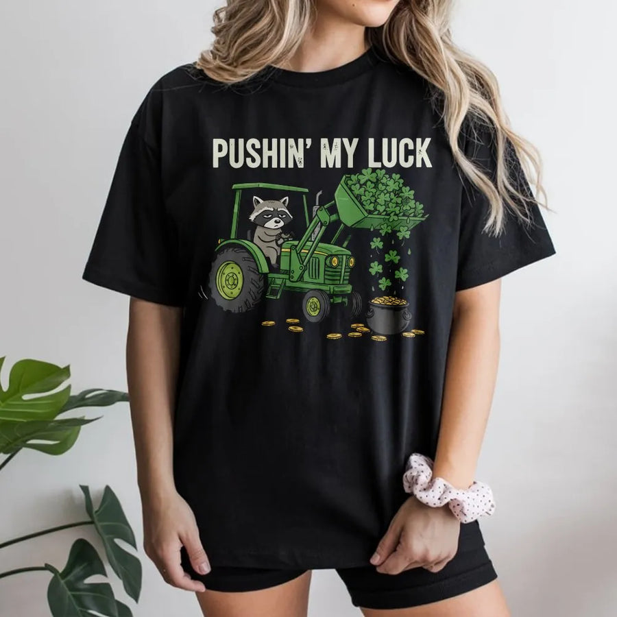 St Patrick’s Day Raccoon T-Shirt | Funny Tractor Clover Graphic | Premium 100% Cotton Tee | Gift for Farmers and Animal Lovers
