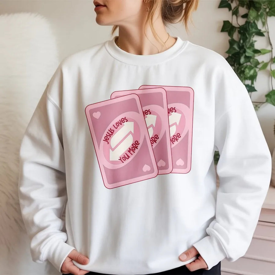 Jesus Loves You More Sweatshirt | Faith-Based Card Game Graphic | Premium Cotton Blend | Gift For Christians And Believers
