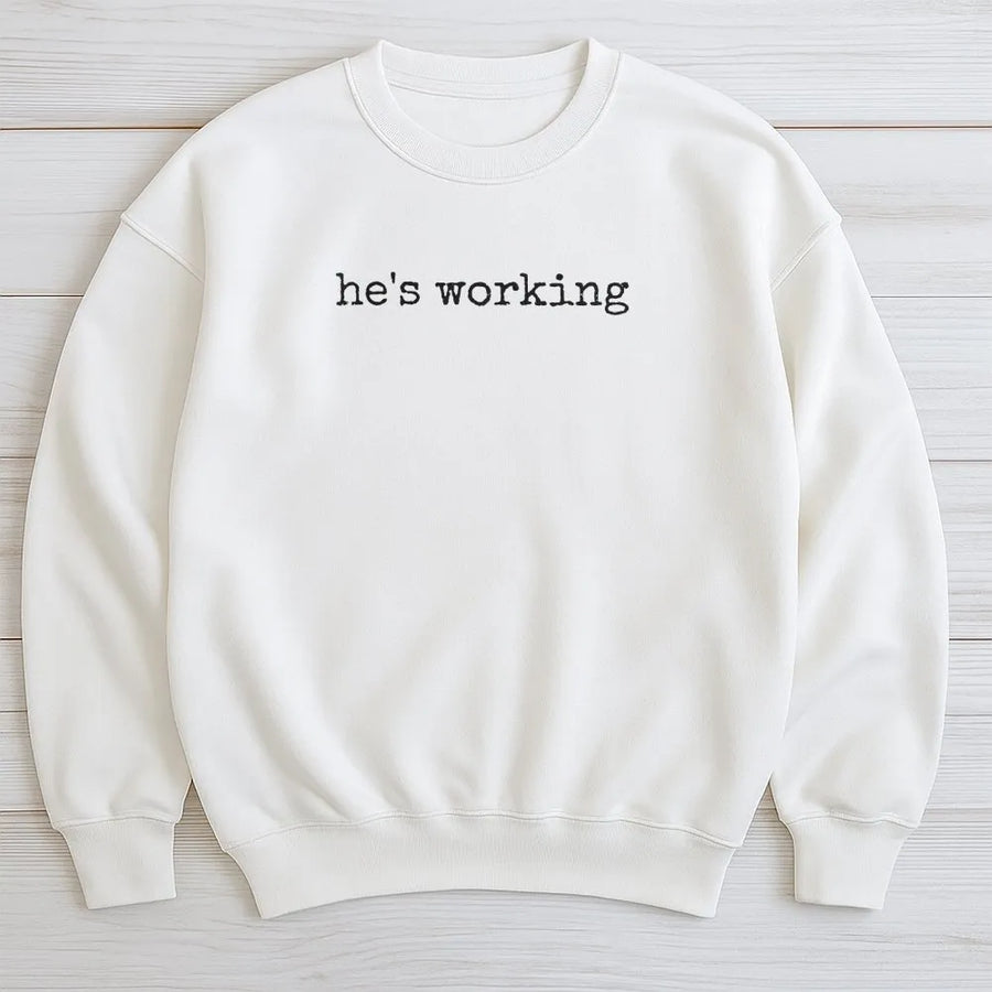 He's Working Sweatshirt | Funny Sarcastic Work Humor Quote | Premium Soft Cotton Pullover | Gift for Coworker or WFH Professional