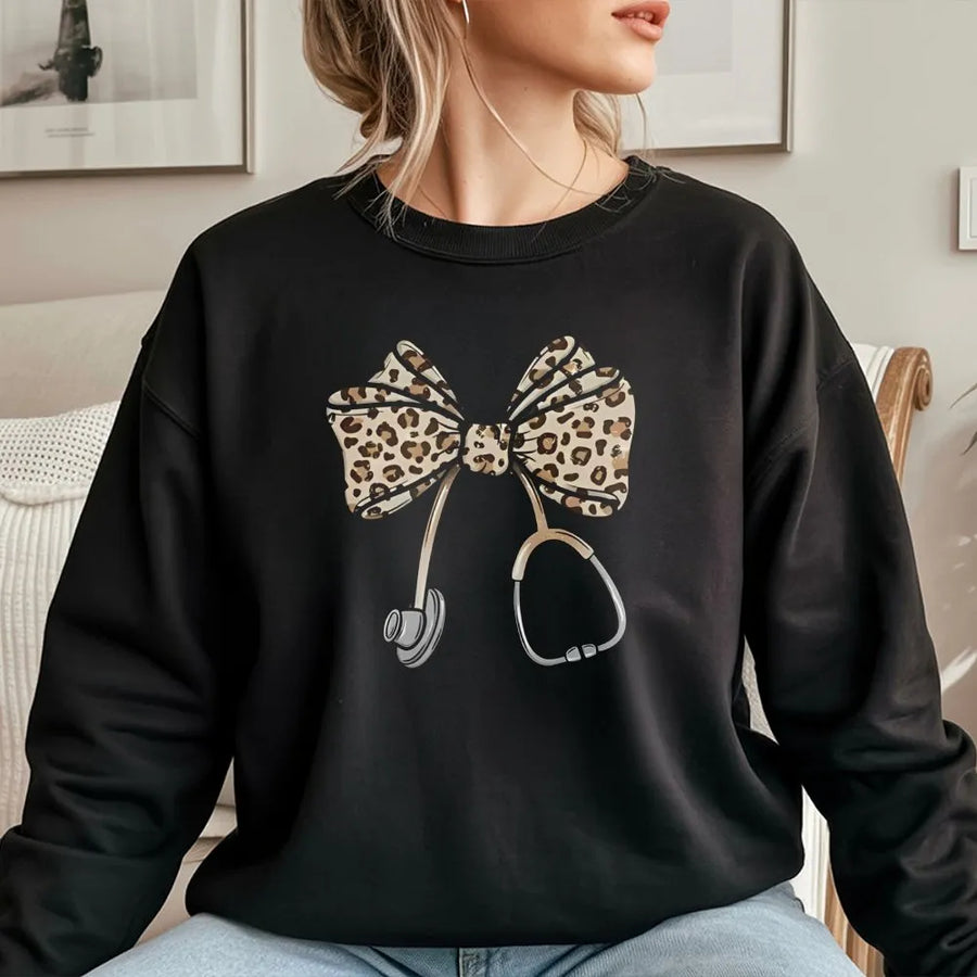Nurse Sweatshirt | Leopard Print Bow Stethoscope Graphic | Premium Cotton Blend | Medical Professional Graduation Gift For Her