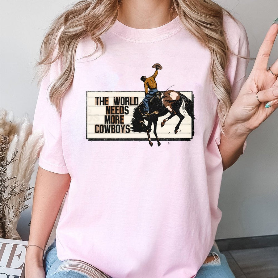 The World Needs More Cowboys T-Shirt | Retro Western Rodeo Graphic Tee | 100% Premium Cotton | Country Music & Ranch Life Gift for Adults