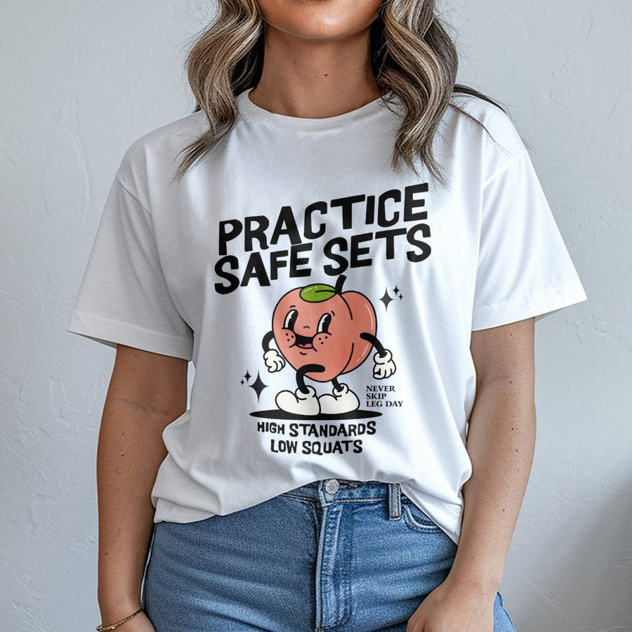 Practice Safe Sets Gym T-Shirt | Funny Peach Workout Graphic | Premium Soft Cotton Tee | Humorous Fitness Gift for Squat Lovers