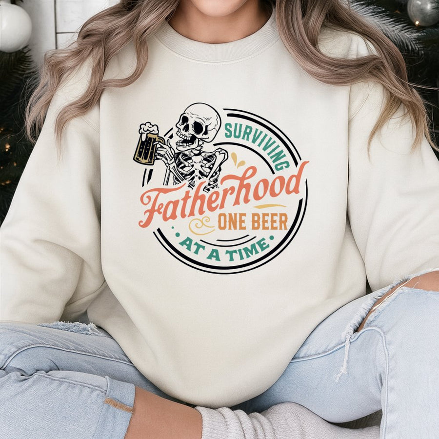 Surviving Fatherhood One Beer At A Time Sweatshirt | Funny Skeleton Drinking Graphic | Premium Cotton Blend | Best Gift Idea For Dad From Kids