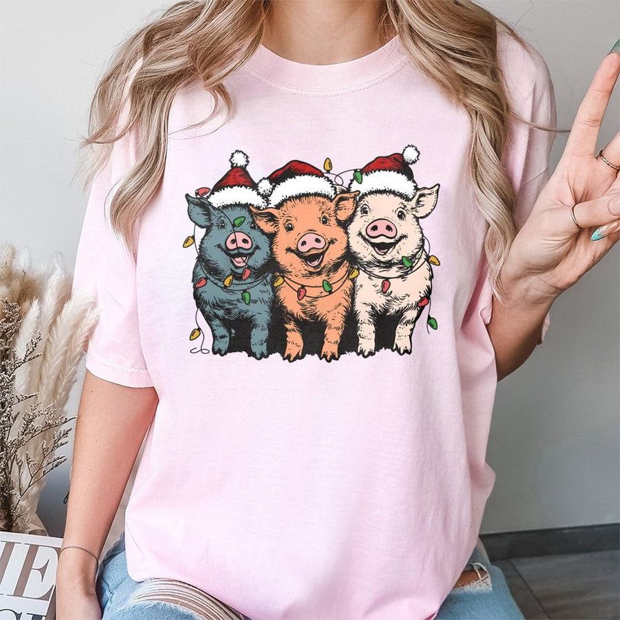 Christmas Pigs T-Shirt | Funny Farm Animals in Santa Hats with Holiday Lights | 100% Cotton Premium Tee | Unique Gift for Pig Lovers & Farmers