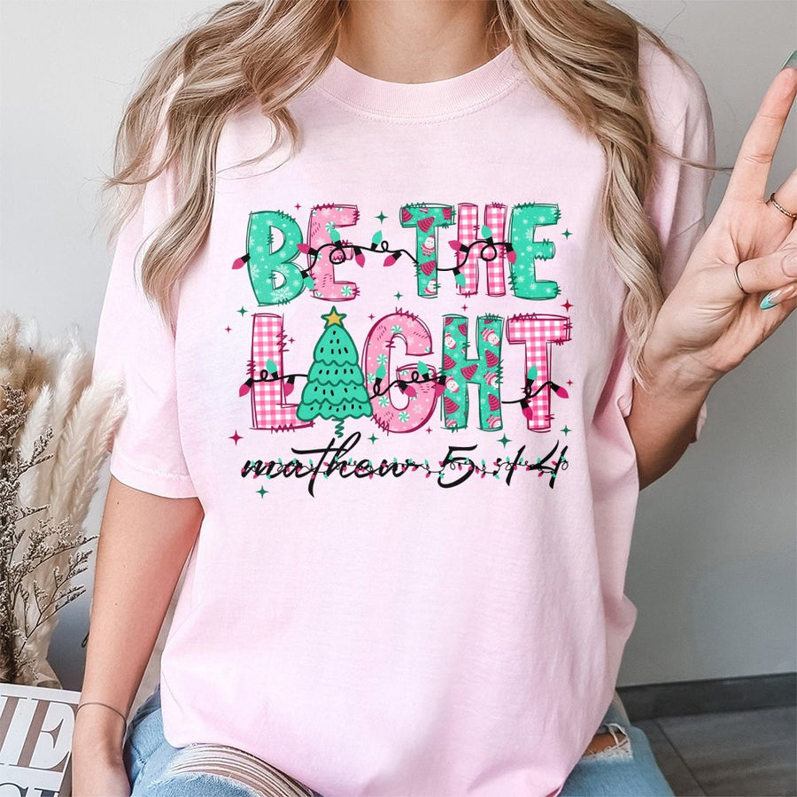 Be The Light Christmas T-Shirt | Bible Verse Matthew 5:14 Graphic | 100% Premium Cotton Tee | Faith-Based Holiday Gift for Women and Men