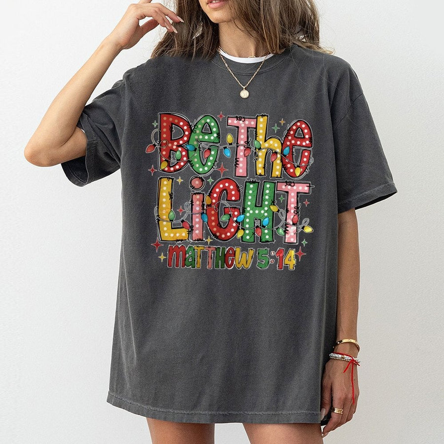 Be The Light Matthew 5:14 T-Shirt | Christmas Lights Graphic Design | 100% Premium Cotton | Faith-Based Christian Holiday Gift For Women