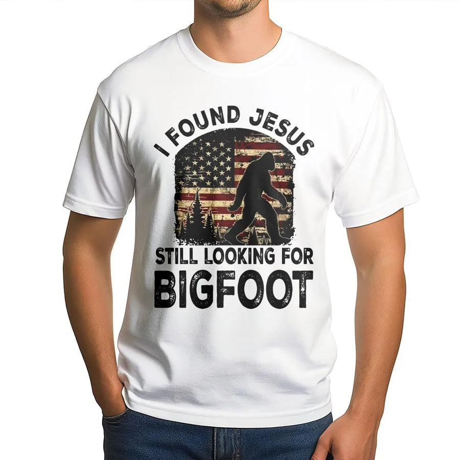 Funny Bigfoot T-Shirt | I Found Jesus Sasquatch Graphic with Retro American Flag | Premium Cotton Tee | Gift for Christian Humor & Hunters