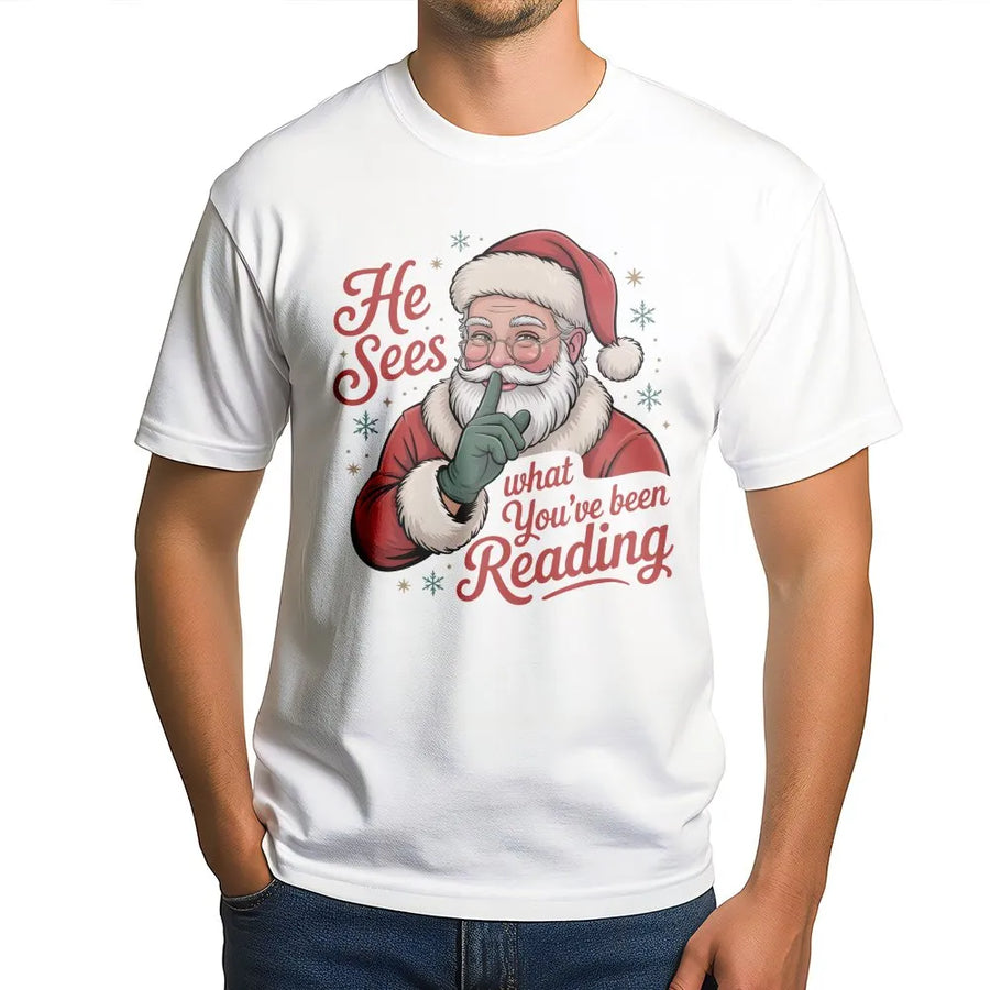 He Sees What You've Been Reading T-Shirt | Funny Book Lover Christmas Graphic | Premium Soft Cotton Tee | Bookish Holiday Gift For Readers