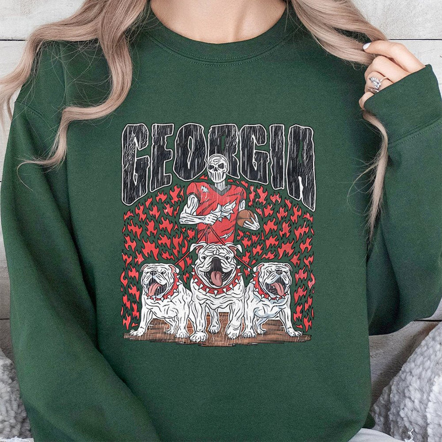Georgia With A Skeletal Football Player Holding A Football, Three Bulldogs, And Flames Sweatshirt