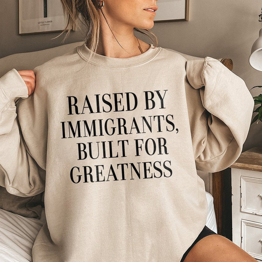Raised By Immigrants Sweatshirt | Built For Greatness Quote Graphic Tee | Premium Cotton Blend | First Generation American Gift for Men and Women
