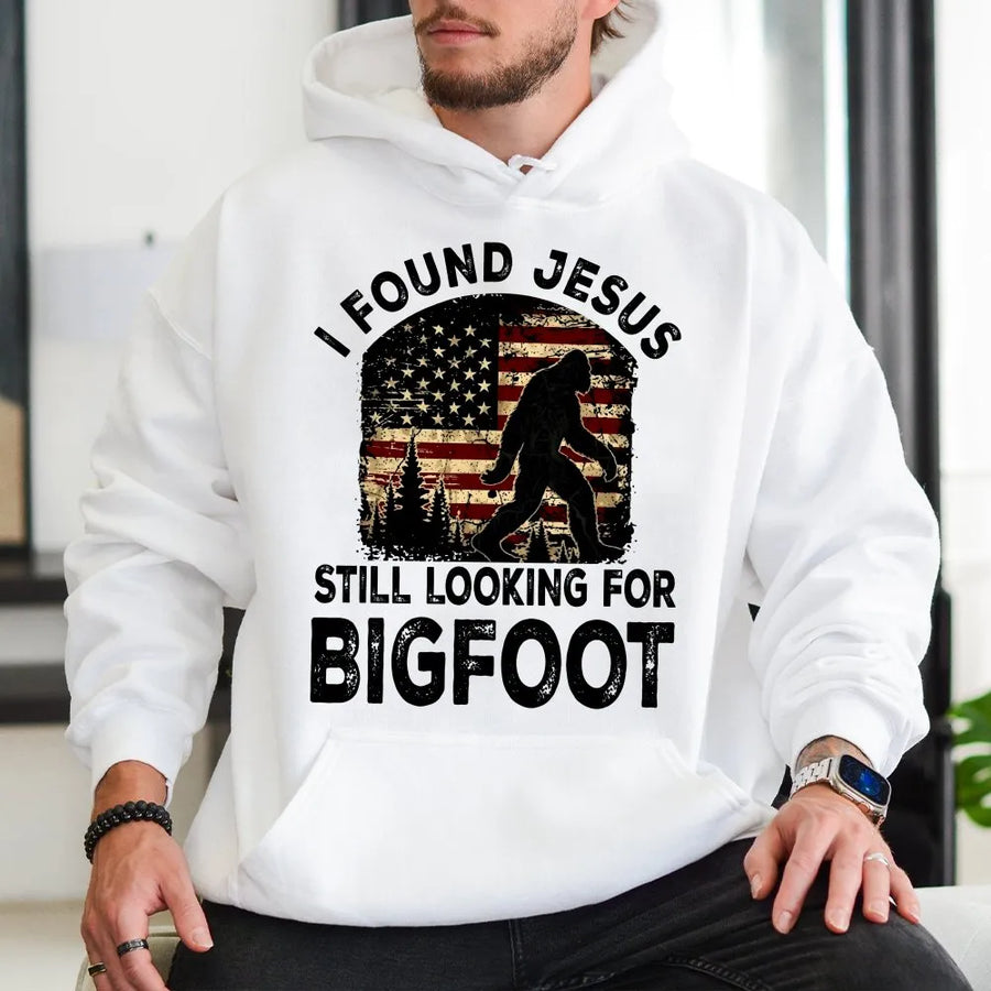 Funny Bigfoot Hoodie | I Found Jesus Sasquatch Graphic with Retro American Flag | Premium Cotton Tee | Gift for Christian Humor & Hunters