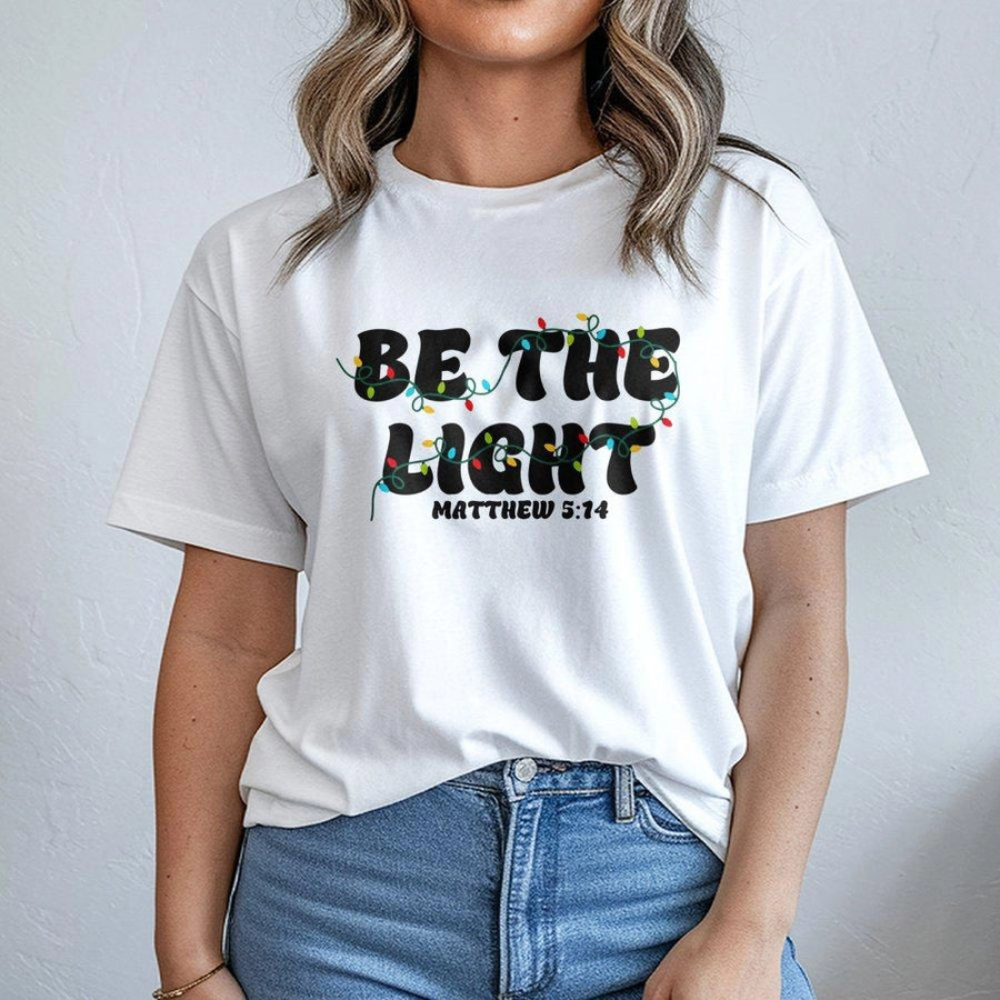 Be The Light Matthew 5:14 T-Shirt | Christmas Bible Verse Christian Graphic Tee | Premium Cotton Soft Crew Neck | Religious Gift for Men and Women