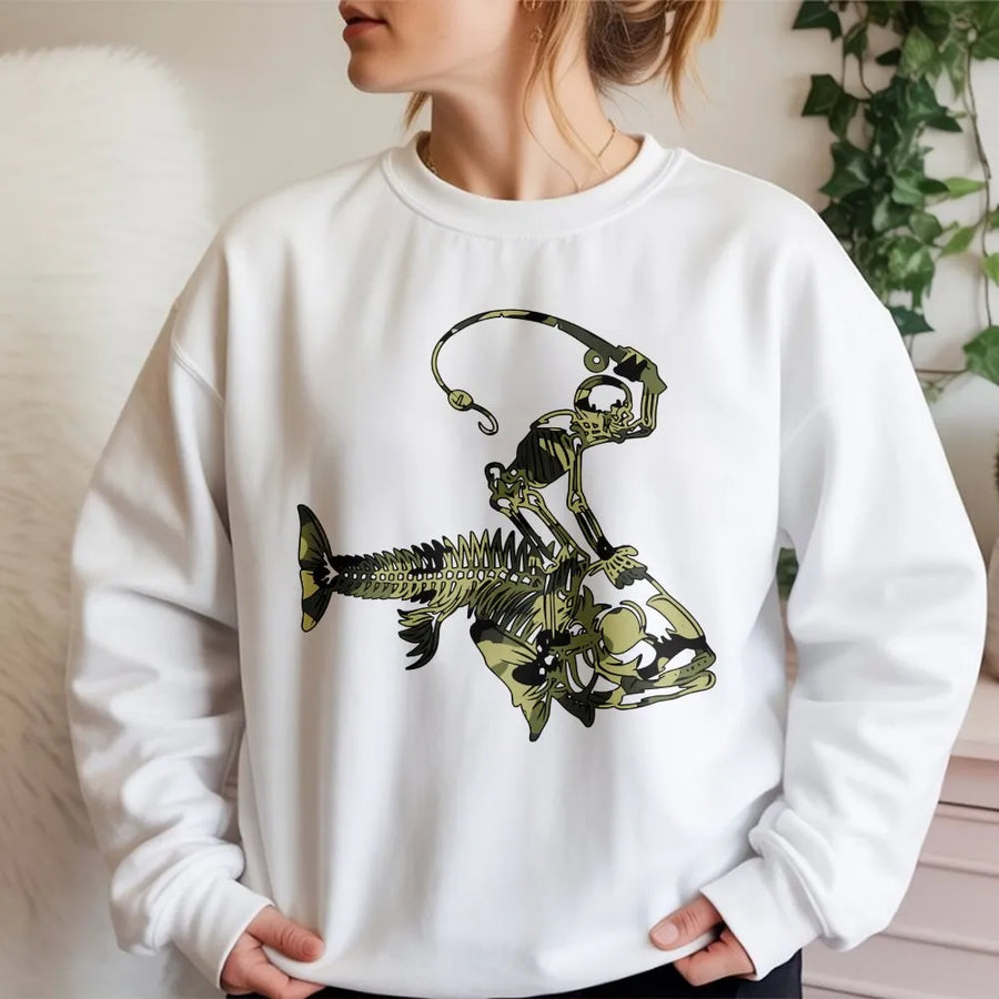 Fishing Skeleton Sweatshirt | Camo Skeleton Riding Fish Graphic | Soft Cotton Blend Pullover | Unique Gift for Fisherman