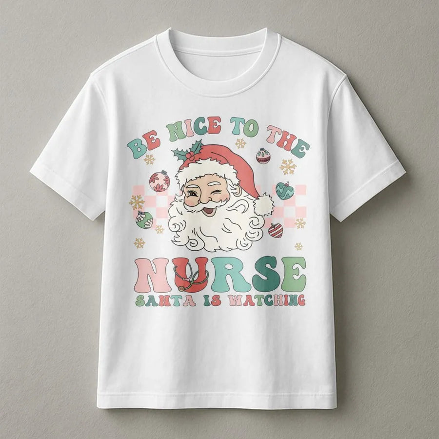 Nurse Christmas T-Shirt | Be Nice To The Nurse Santa Is Watching Graphic | Premium Soft Cotton Tee | Funny RN Holiday Gift For Nurses