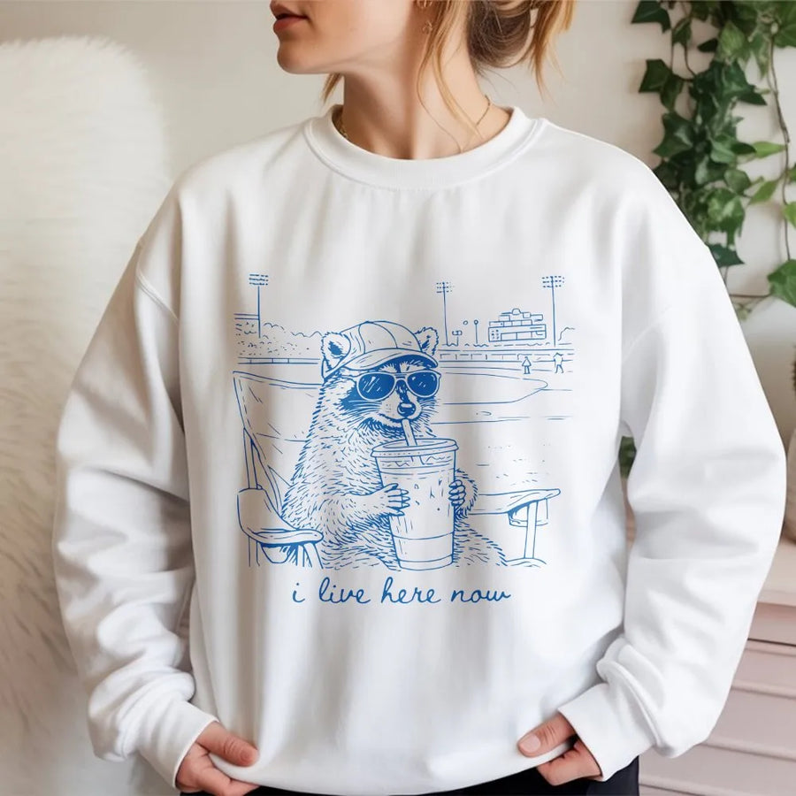 Funny Raccoon Baseball Sweatshirt | 'I Live Here Now' Graphic Sweatshirt | Premium Soft Blend | Humorous Gift for Sports Moms and Parents