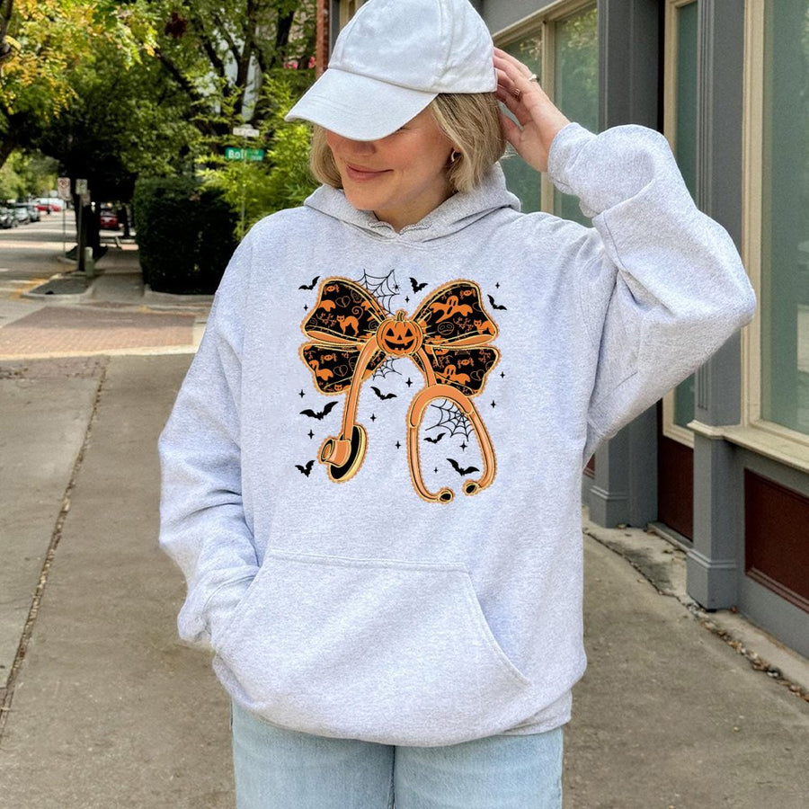 Halloween Nurse Hoodie | Pumpkin Bow Stethoscope Graphic | Premium Cotton Blend | Spooky Gift for Doctors and Nurses
