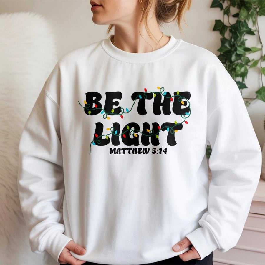 Be The Light Sweatshirt | Christmas Bible Verse Graphic | Premium Cotton Blend | Christian Faith Holiday Gift for Believers