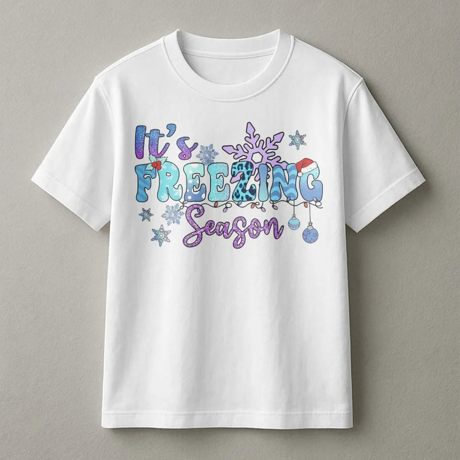 It's Freezing Season T-Shirt | Retro Groovy Snowflake Holiday Graphic | Premium Cotton Unisex Apparel | Cute Christmas Gift for Women & Family