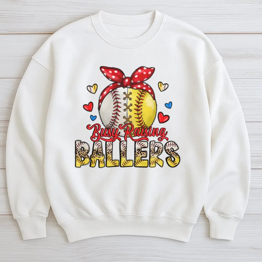 Busy Raising Ballers Sweatshirt | Baseball Softball Mom Graphic Design | Premium Cotton Blend | Game Day Gift for Baseball Mama
