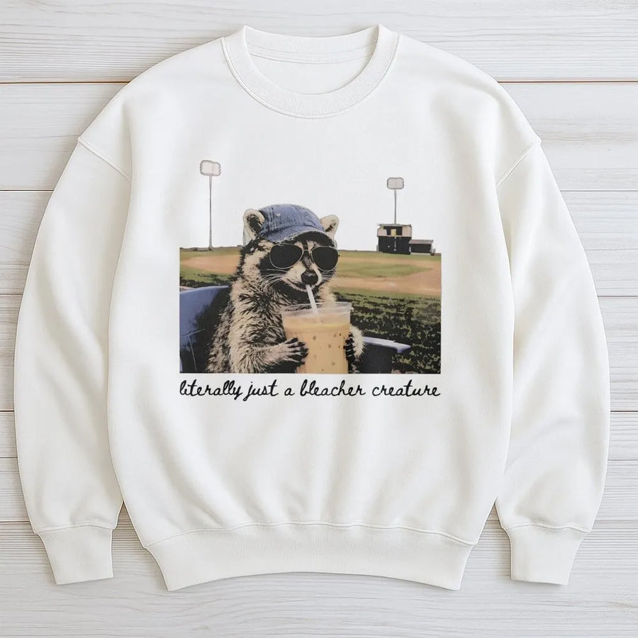 Raccoon Baseball Sweatshirt | Funny Bleacher Creature Graphic | Cotton Blend Apparel | Gift for Baseball Mom and Softball Fan