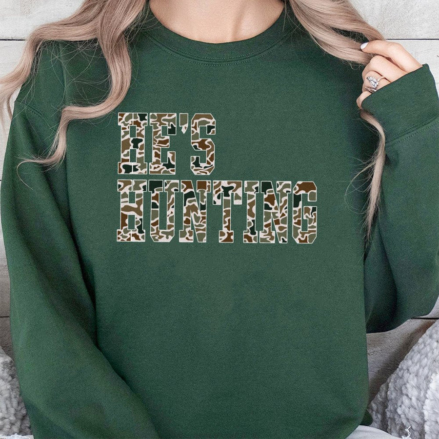 He's Hunting Sweatshirt | Camo Lettering Design | Premium Cotton-Poly Blend | Funny Deer Hunter Wife Gift for Outdoor Enthusiasts