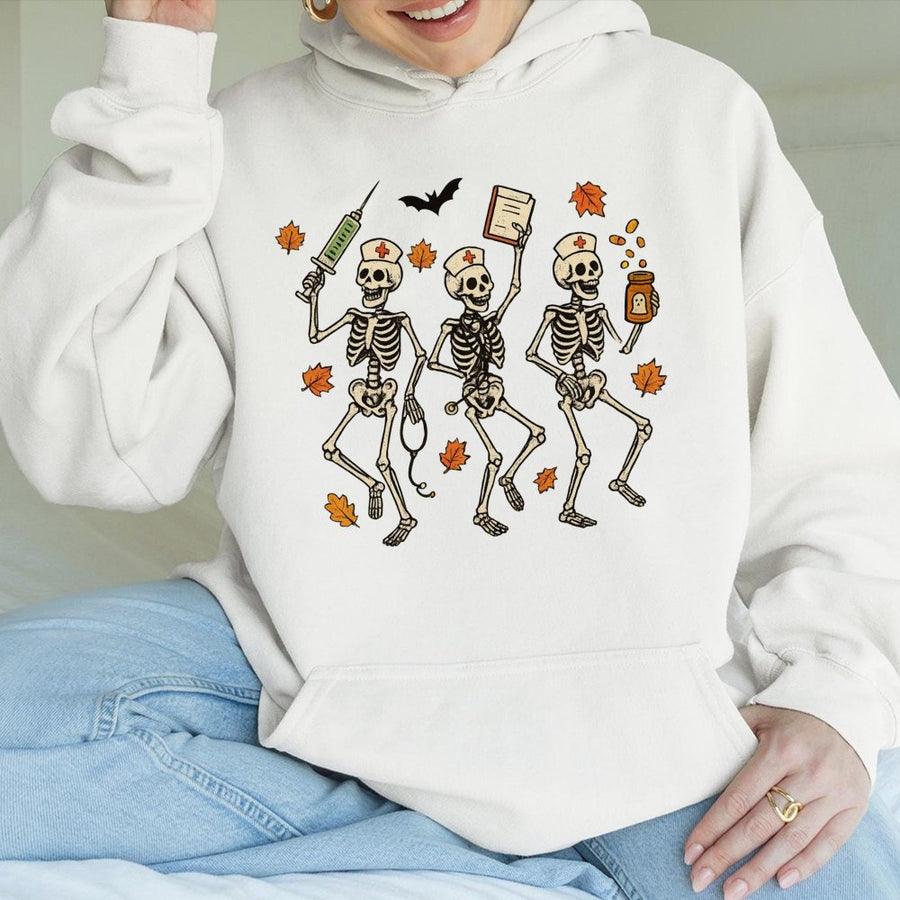 Halloween Nurse Skeleton Hoodie | Spooky Dancing Skeletons Graphic | Premium Cotton Blend | Funny RN Nursing Student Gift for Fall Season