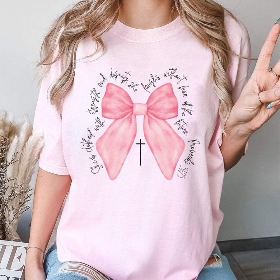 Proverbs 31:25 Bible Verse T-Shirt | Pink Bow Coquette Aesthetic Graphic | Premium 100% Cotton Tee | Christian Faith Gift for Women