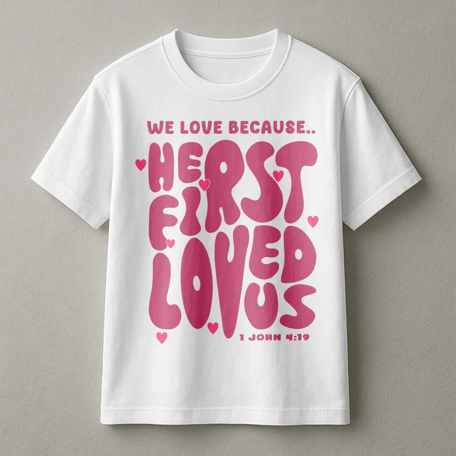 We Love Because He First Loved Us T-Shirt | Retro Groovy Bible Verse Graphic | Premium 100% Cotton Tee | Christian Gift for Women and Men