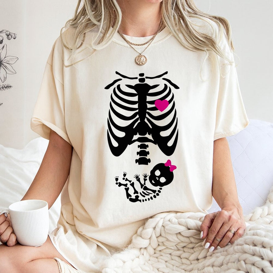Funny Pregnant Skeleton T-Shirt | Cute Baby Girl Skeleton Reveal Graphic | Premium Soft Cotton Tee | Maternity Halloween Gift For Expecting Mom