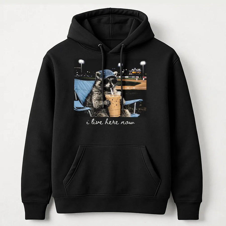 Funny Raccoon Baseball Hoodie | 'I Live Here Now' Graphic Tee | Soft Cotton Unisex Tee | Gift for Baseball Mom or Softball Dad Tournament Fan