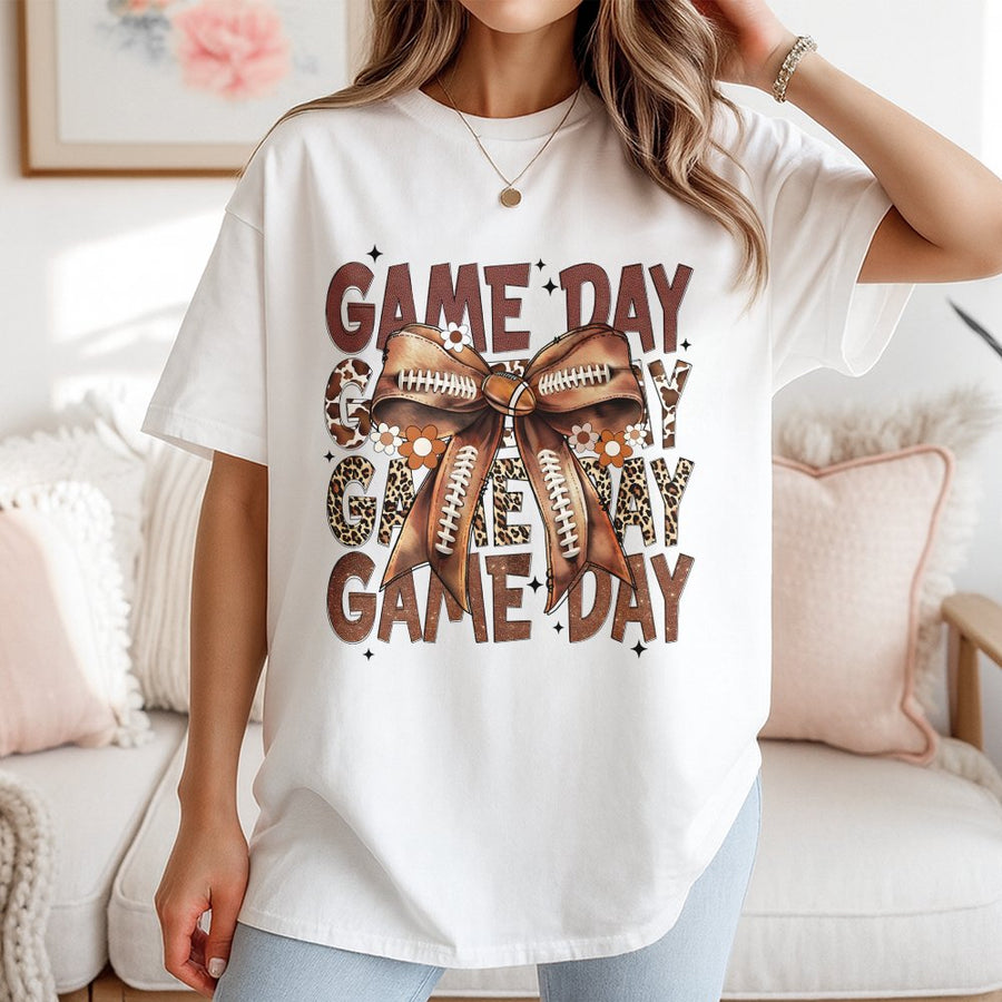Game Day Football T-Shirt | Boho Leopard Bow Graphic Print | 100% Cotton Premium Tee | Trendy Fall Sports Fan Gift For Her