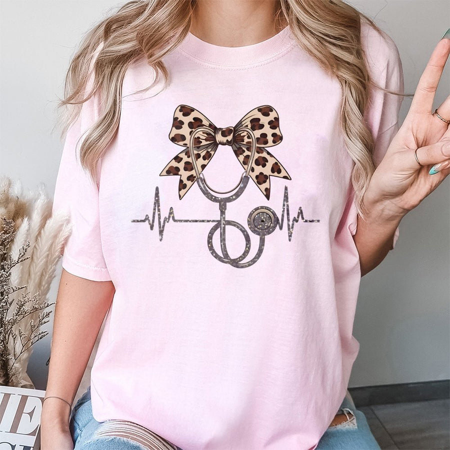 Nurse T-Shirt With Leopard Coquette Bow | Cute Stethoscope Heartbeat Graphic | 100% Cotton Premium Tee | Graduation Gift For Registered Nurse