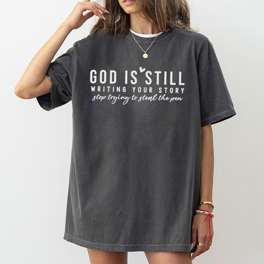 God Is Still Writing Your Story T-Shirt | Faith-Based Graphic Tee | 100% Soft Cotton Premium Quality | Inspirational Christian Gift for Women & Men