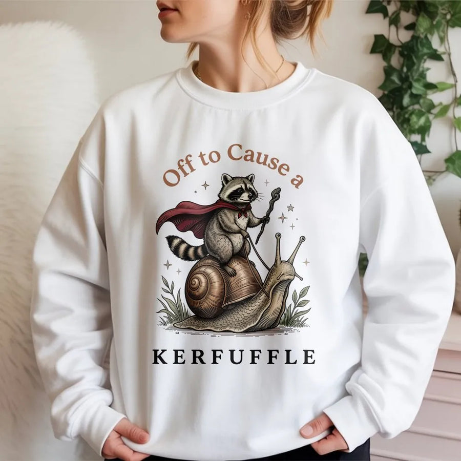 Off To Cause A Kerfuffle Sweatshirt | Funny Raccoon Riding A Snail Graphic | Premium Unisex Crewneck | Cute Animal Lover Gift