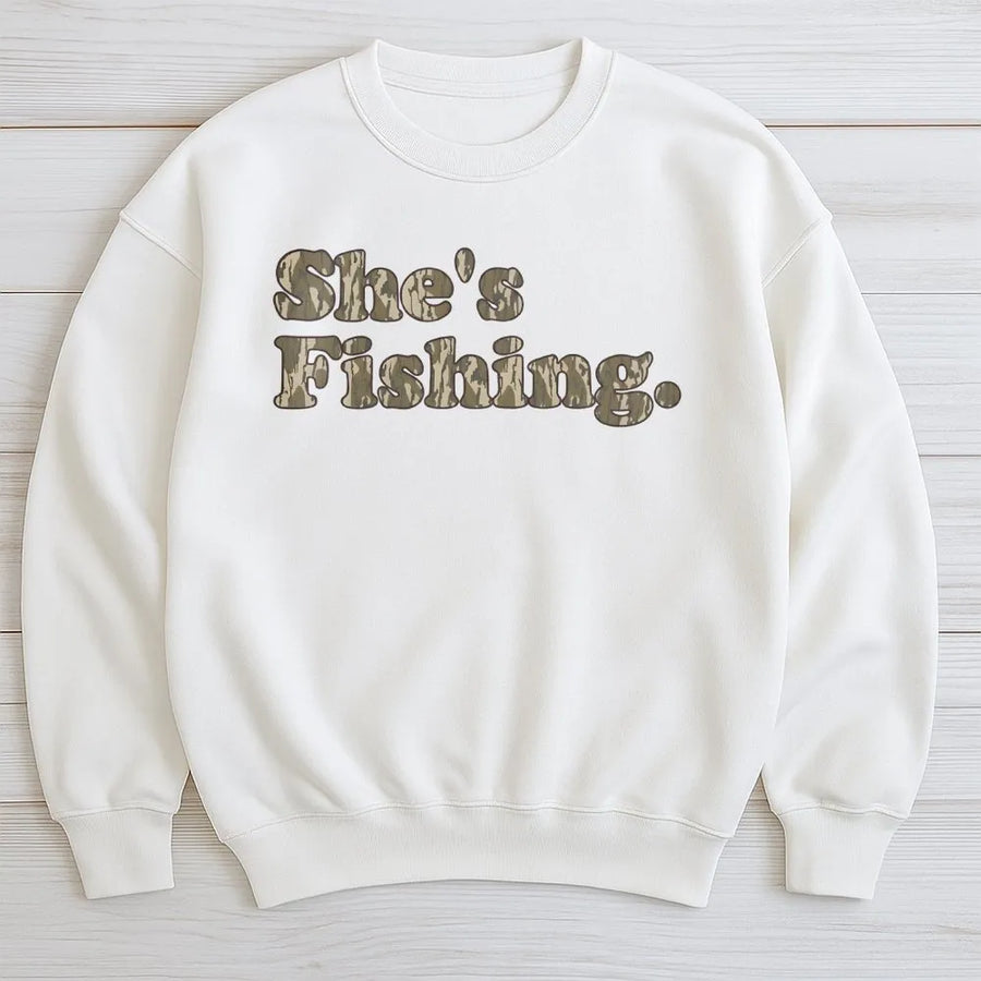 She's Fishing Sweatshirt | Camo Print Retro Font | Premium Cotton Blend | Gift for Women Anglers and Outdoorsy Fishermen