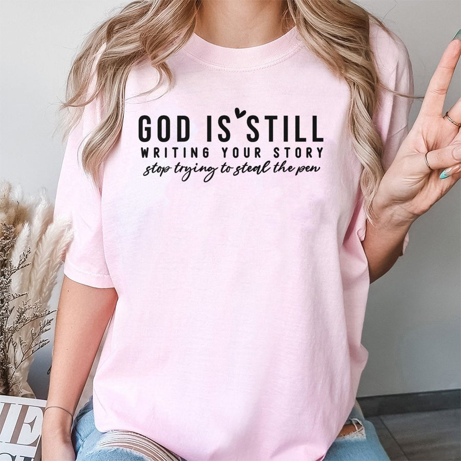 God Is Still Writing Your Story T-Shirt | Faith-Based Graphic Tee | 100% Soft Cotton Premium Quality | Inspirational Christian Gift for Women & Men