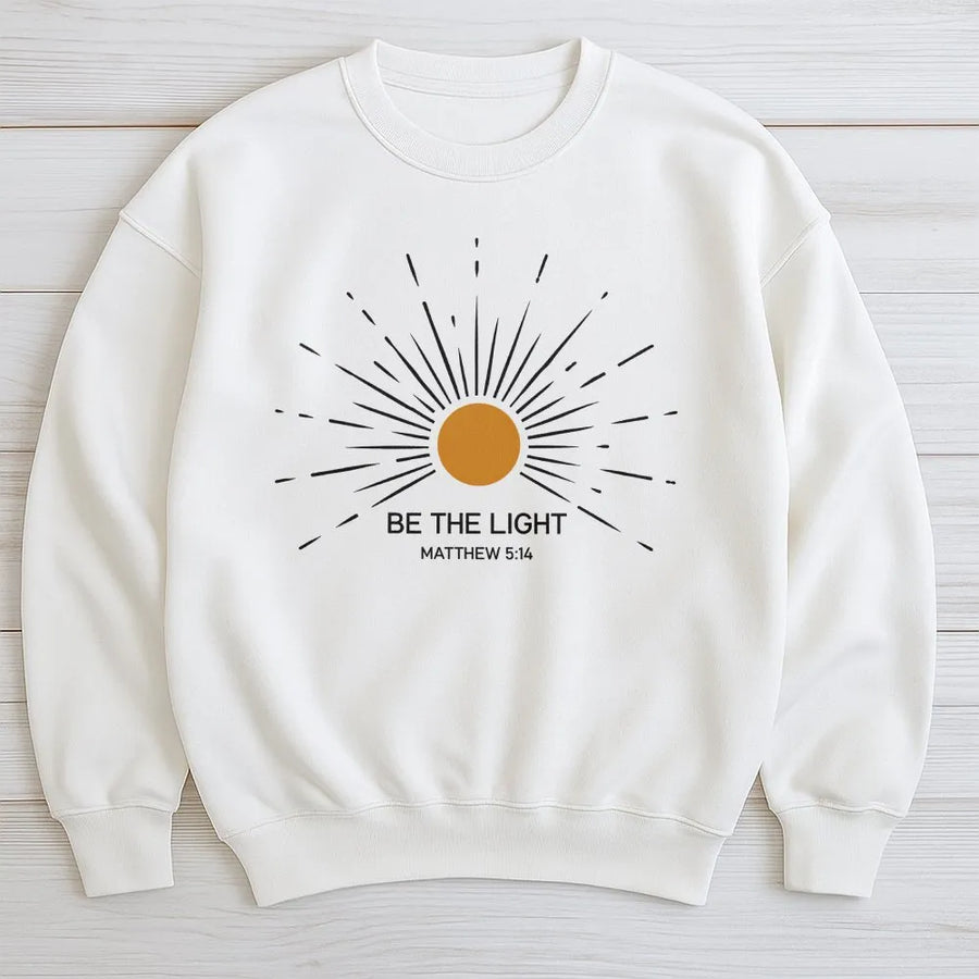 Be The Light Christian Sweatshirt | Matthew 5:14 Sunburst Graphic | Cotton Blend Premium Apparel | Faith Based Gift for Men and Women