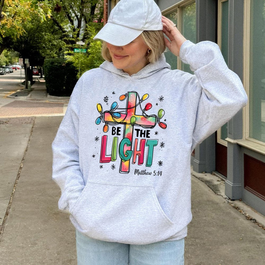 Be The Light Christian Hoodie | Colorful Christmas Cross Design | Premium Cotton-Blend Fleece | Matthew 5:14 Religious Gift for Her