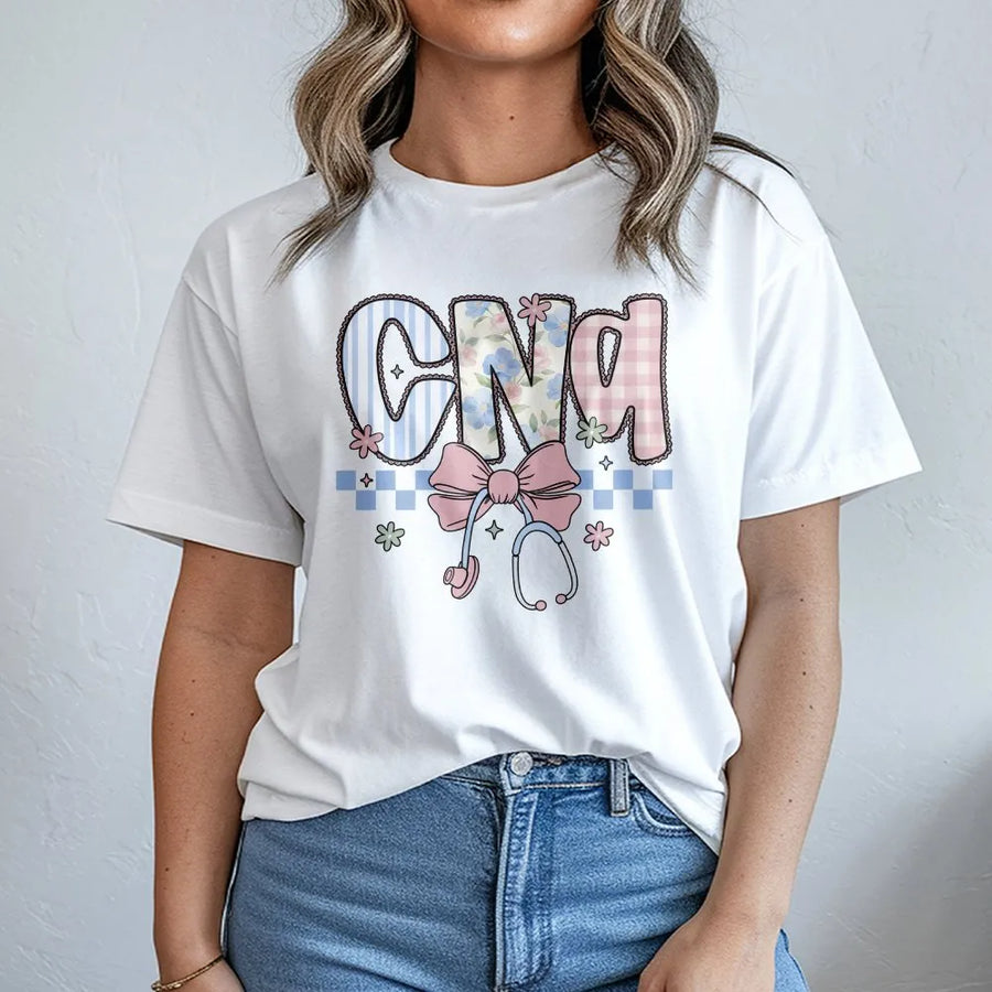 CNA Nurse T-Shirt | Coquette Floral Stethoscope Bow Graphic | Soft Cotton Blend | Nurses Week Appreciation Gift for Certified Nursing Assistant